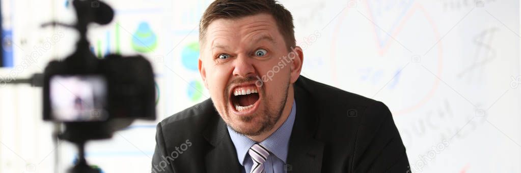 Businessman blogger online couch screaming