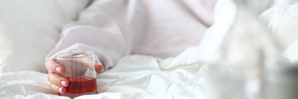Young woman lying in bed deadly drunken