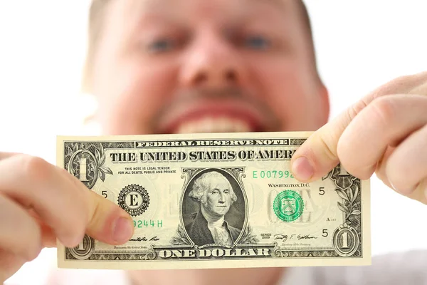 ビジネスの成功についていくつかのポイントを作る1ドル紙幣を保持している男性の手 — ストック写真