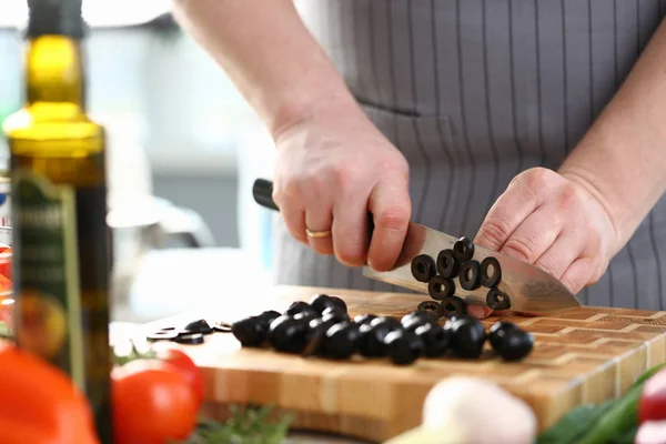Professional Chef Cutting Black Olive Ingredient