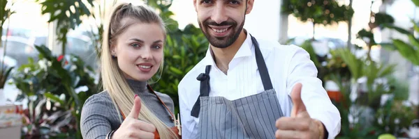 Plant Florist Man and Woman Showing Cool Gesture