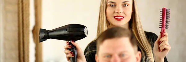 Blonde Hairstylist Using Dryer and Comb for Man — Stock Photo, Image