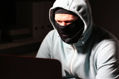 Man carder in mask connect to darknet clipart