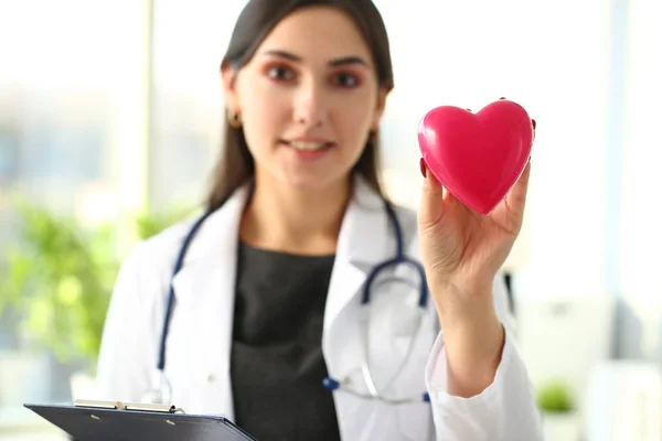 Beautiful smiling blond female doctor hold — Stock Photo, Image