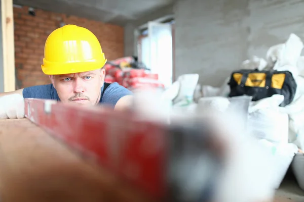 Concentrated professional with hard gloves — Stock Photo, Image