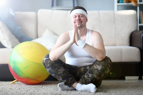 Smiling Man with Crossed Legs Doing Yoga at Home — Stock Photo, Image