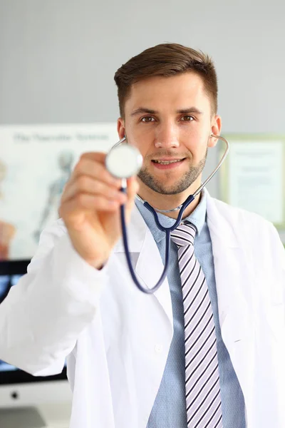 Doc holding stethoscope