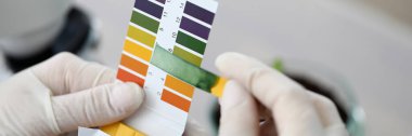 Litmus paper shows acidity, chemical analysis clipart