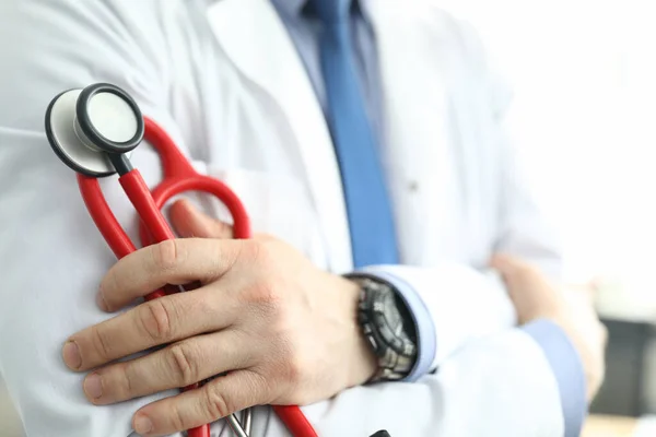 Person wearing white uniform and watch — Stock Photo, Image