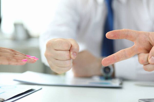 Cropped photo of hands making sign as rock paper and scissors