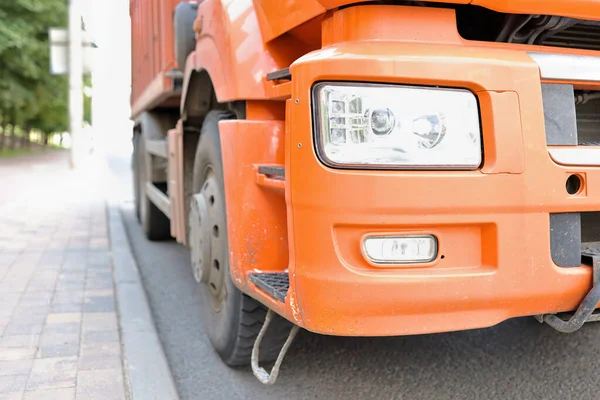 Truck is standing on roadway front bumper closeup