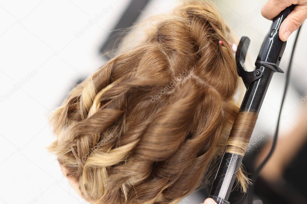 Hair curlers make curls on womens hair.