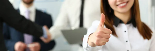 Woman showing confirm symbol during conference in office — Stock Photo, Image