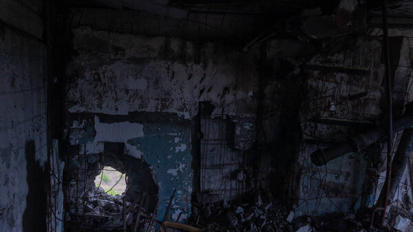 Krasnohorivka, Donetsk region/Ukraine - 24 September 2019: Destroyed by shelling houses and someone homes, the view through windows to Donetsk controlled by prorussian separatists  