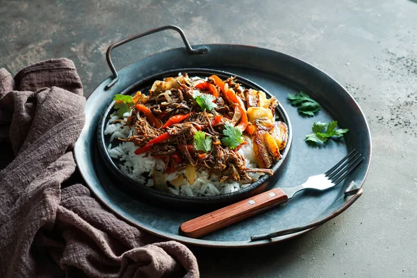 Latin america food .Ropa Vieja with Fried Plantains and rice. carne desmechada, carne desmenuzada, carne mechada  tipical food of Chile, Colombia, Costa Rica, Cuba, Spain, Honduras, Mexico