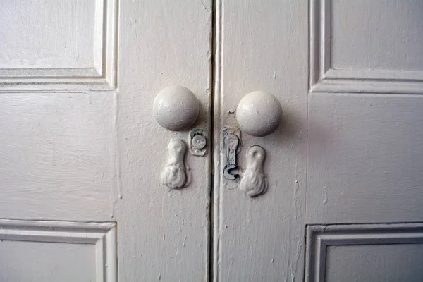 Simple Antique Door Knobs on Double Doors