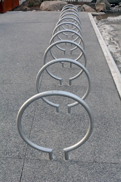 Row of Bike Racks On Sidewalk by Park