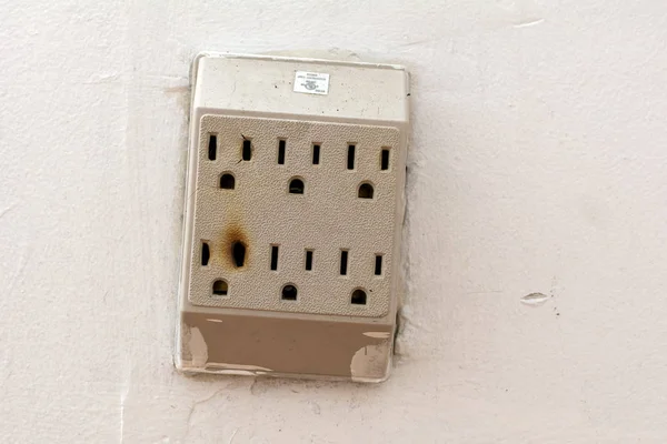 Damaged Wall Socket with Burn Marks