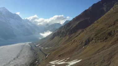 Beautiful mountains of the Caucasus. Fog in the mountains. Glacier /   .   . 