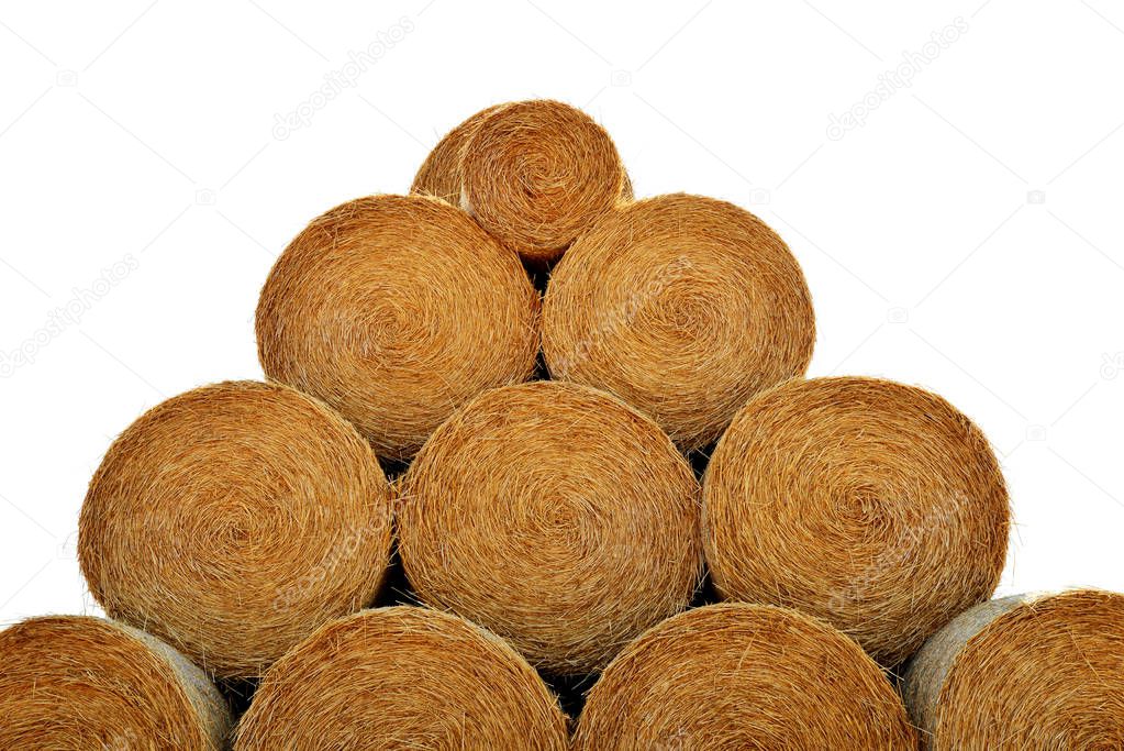 Round hay bales isolated on a white background.