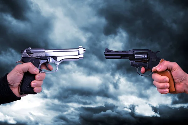 Two Hand Holding Gun Revolvers Background Stormy Dark Sky — Stock Photo, Image