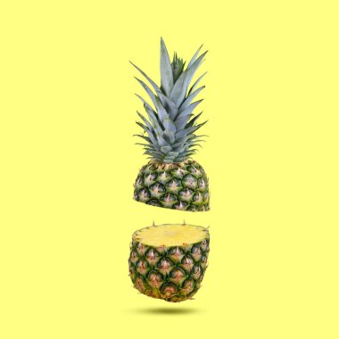 Taze tropikal meyve ananas sarı zemin üzerine.