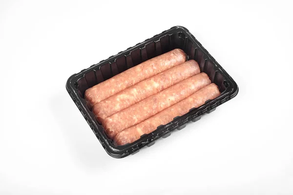 Package of raw sausages isolated on white background — Stock Photo, Image