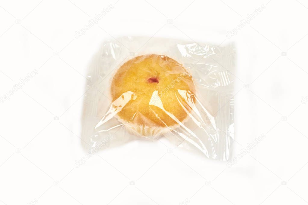 muffins packed in transparent packaging, on a white background.