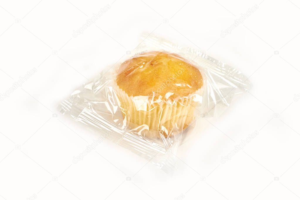 muffins packed in transparent packaging, on a white background.