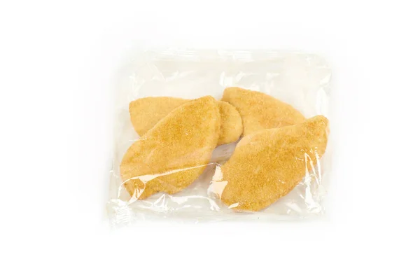 Fried chicken breast in a transparent packageon white background. — Stock Photo, Image