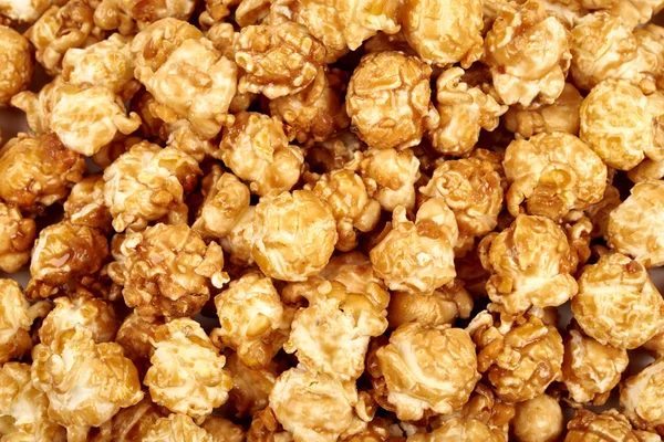 Popcorn karamel textuur, foto in de studio. — Stockfoto
