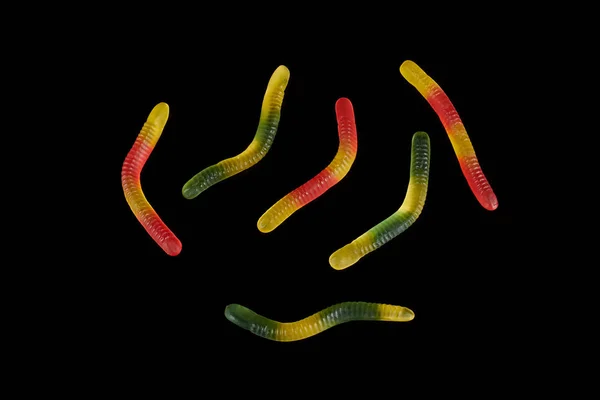 Gummy jelly worm candy on a black background. — Stock Photo, Image