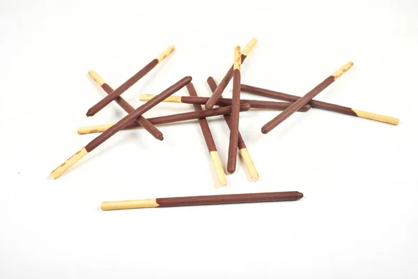 Biscuit sticks in chocolate coating on white background. — Stock Photo, Image