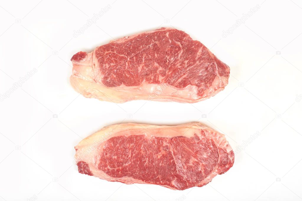 raw beef sirloin steak isolated on white background.