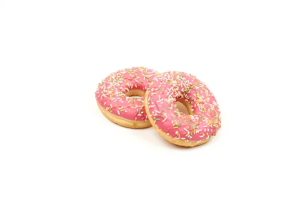 Roze donut met kleurrijke hagelslag geïsoleerd op witte achtergrond. — Stockfoto