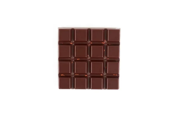 Gorzkiej czekolady z orzechami na białym tle na białym tle. — Zdjęcie stockowe
