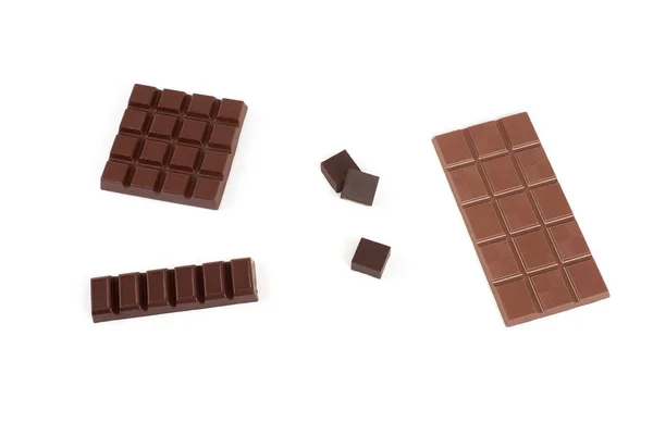Conjunto com diferentes tipos de chocolate no fundo branco . — Fotografia de Stock