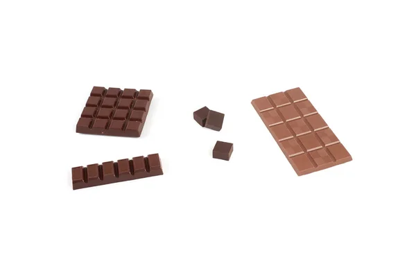 Conjunto com diferentes tipos de chocolate no fundo branco . — Fotografia de Stock