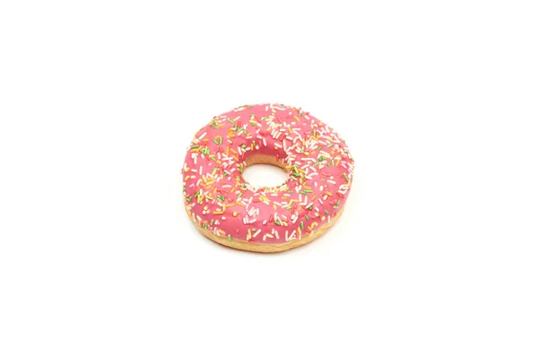 Rosado donut con coloridos espolvoreos aislados sobre fondo blanco. — Foto de Stock