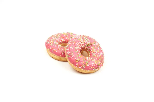 Donut rosa com polvilhas coloridas isoladas em fundo branco . — Fotografia de Stock