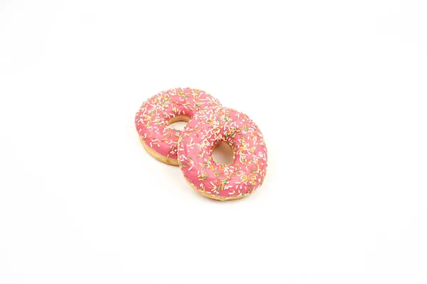 Pink donut with colorful sprinkles isolated on white background. — Stock Photo, Image