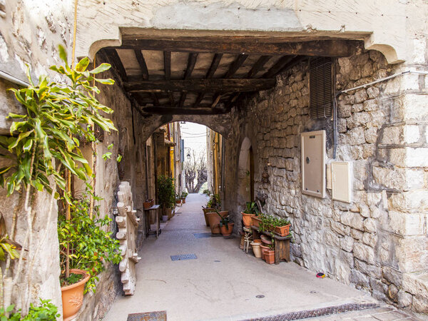 VENCE, FRANCE, on March 8, 2018. The typical urban view characteristic of the small mountain town in Provence. Picturesque stone arch