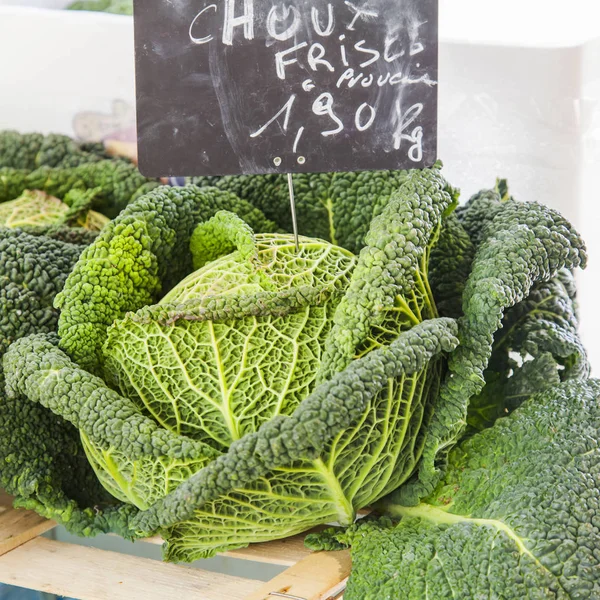 Fresh cabbage on a market counter