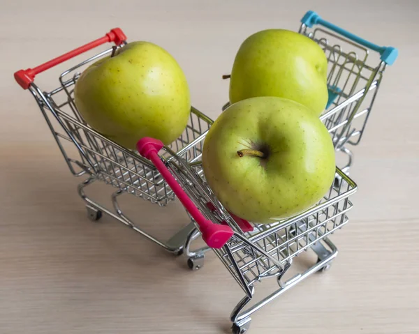 Three Green Fresh Tasty Apples Store Carts — Stock Photo, Image