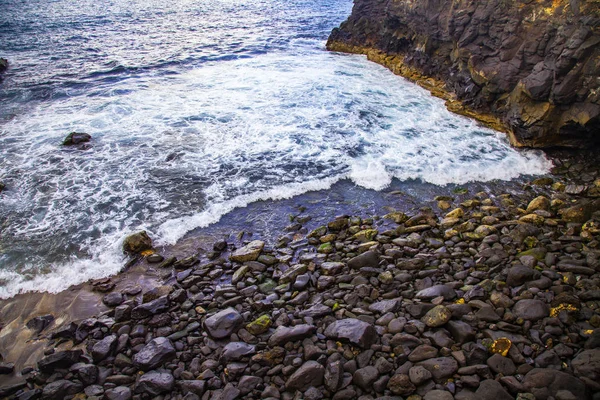 Picturesque surf at the coast of a bay in the Atlantic Ocean