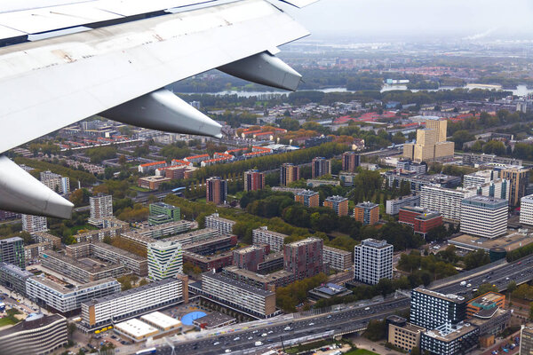AMSTERDAM, NETHERLANDS, on OCTOBER 23, 2018. A view of suburbs of Amsterdam from a window of the plane coming in the land at the international airport Schiphol
