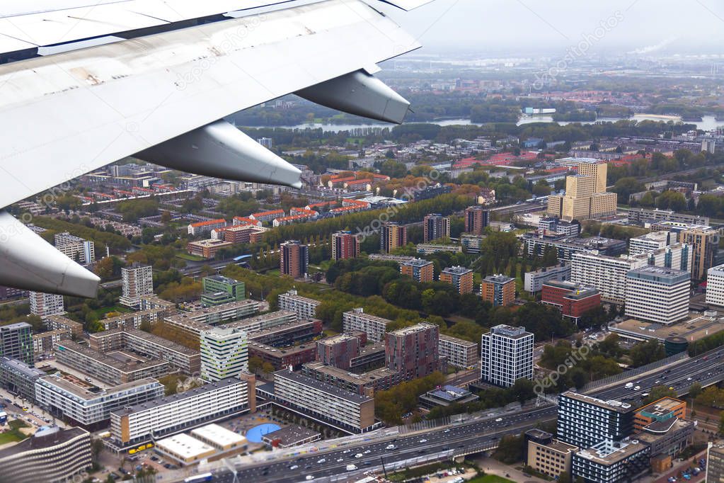 AMSTERDAM, NETHERLANDS, on OCTOBER 23, 2018. A view of suburbs of Amsterdam from a window of the plane coming in the land at the international airport Schiphol
