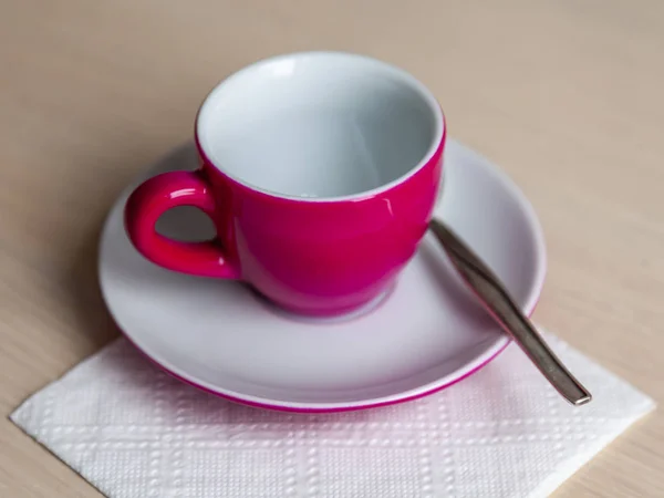 Pink coffee cup and saucer