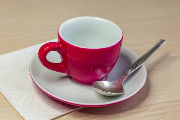 Pink coffee cup and saucer