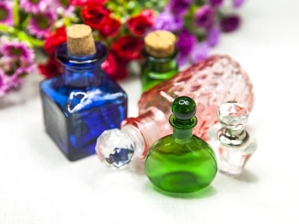 Cosmetics Vintage Bottles Motley Flowers Background — Stock Photo, Image